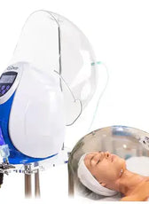 a woman laying in a Oxygen Dome with a machine on top of it